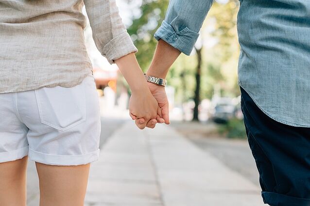 A man without a potency problem takes a woman's hand